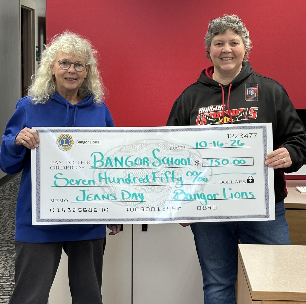Bangor Lions representative presenting a check to Jeans Day Fund