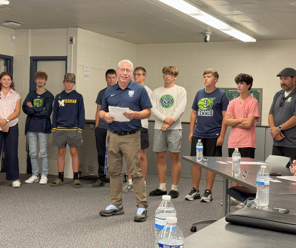 photo of tennis team presenting at board meeting