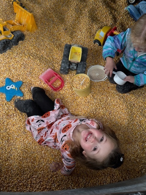 kids playing in corn