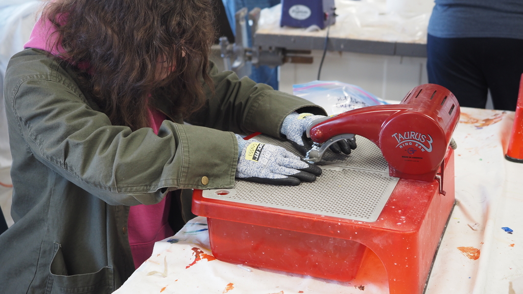 students cutting glass