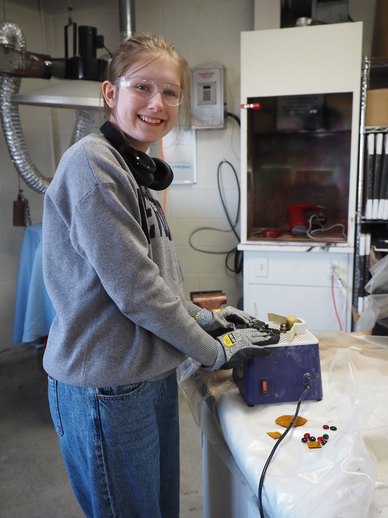 students cutting glass