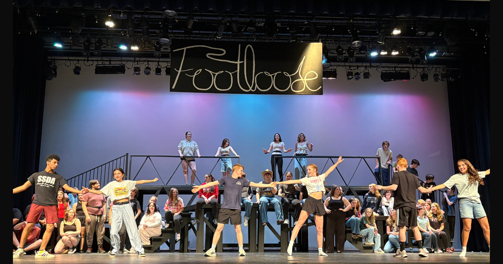 The cast dances to the song, "Footloose" during rehearsal last week.  