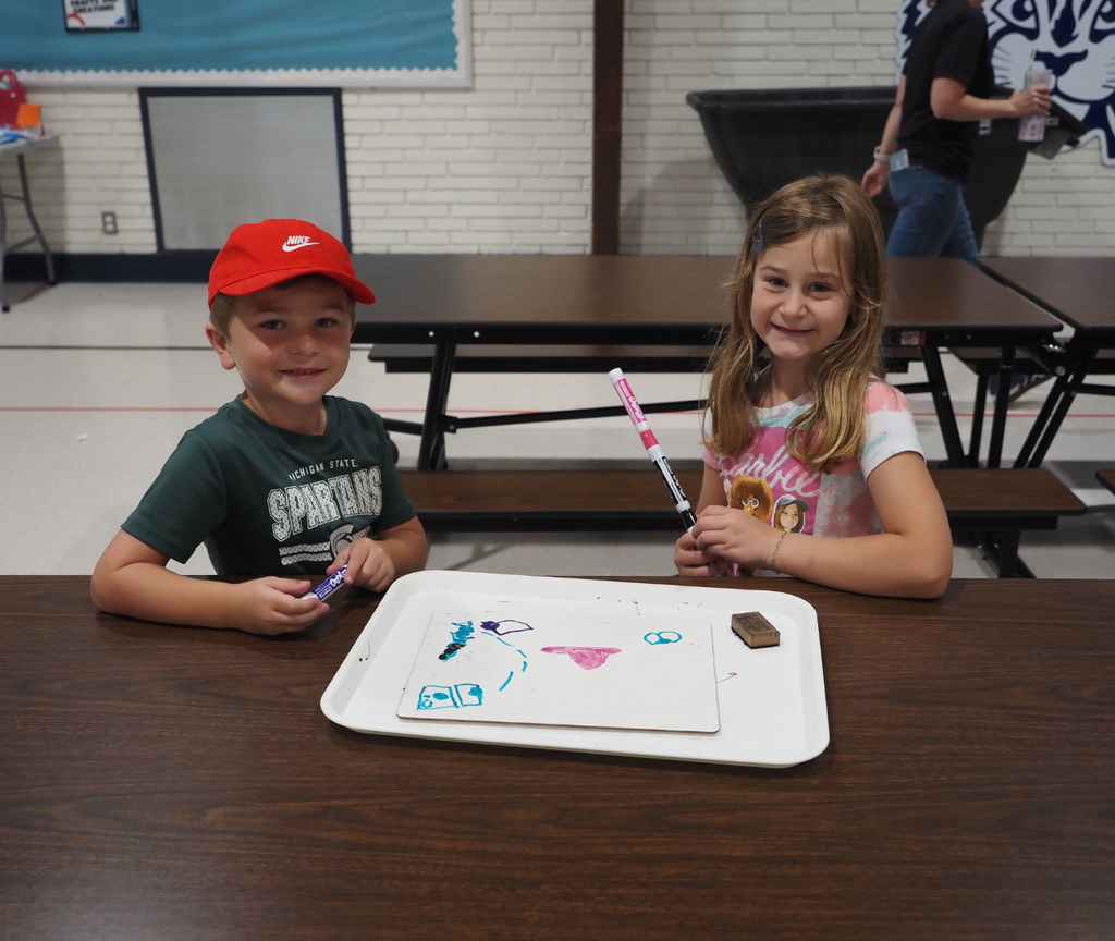 two kids drawing together