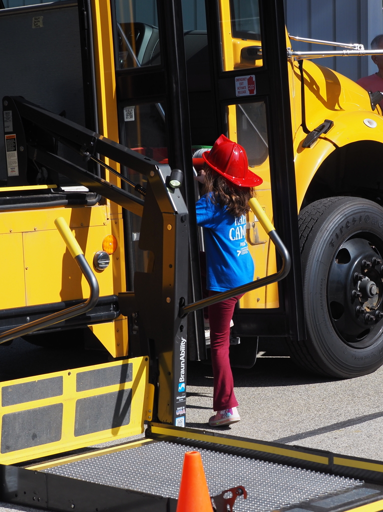 student getting on bus