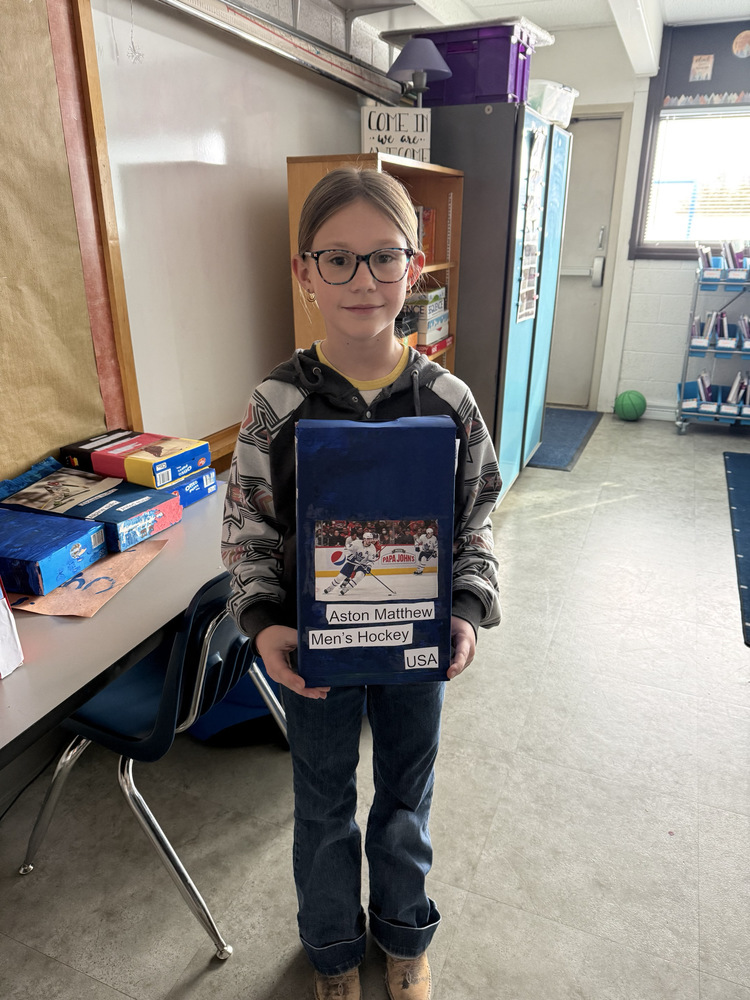 Student holding a project