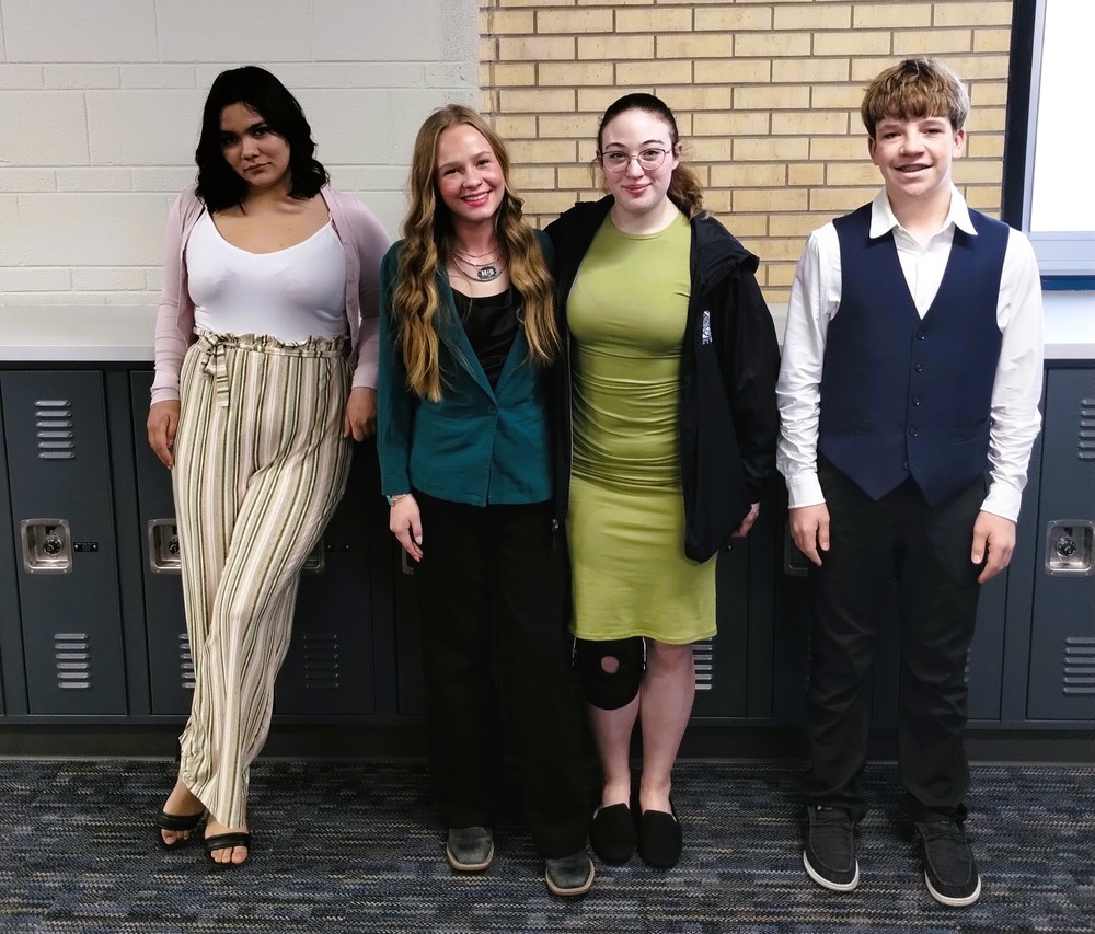 Four Students at a Speech Meet