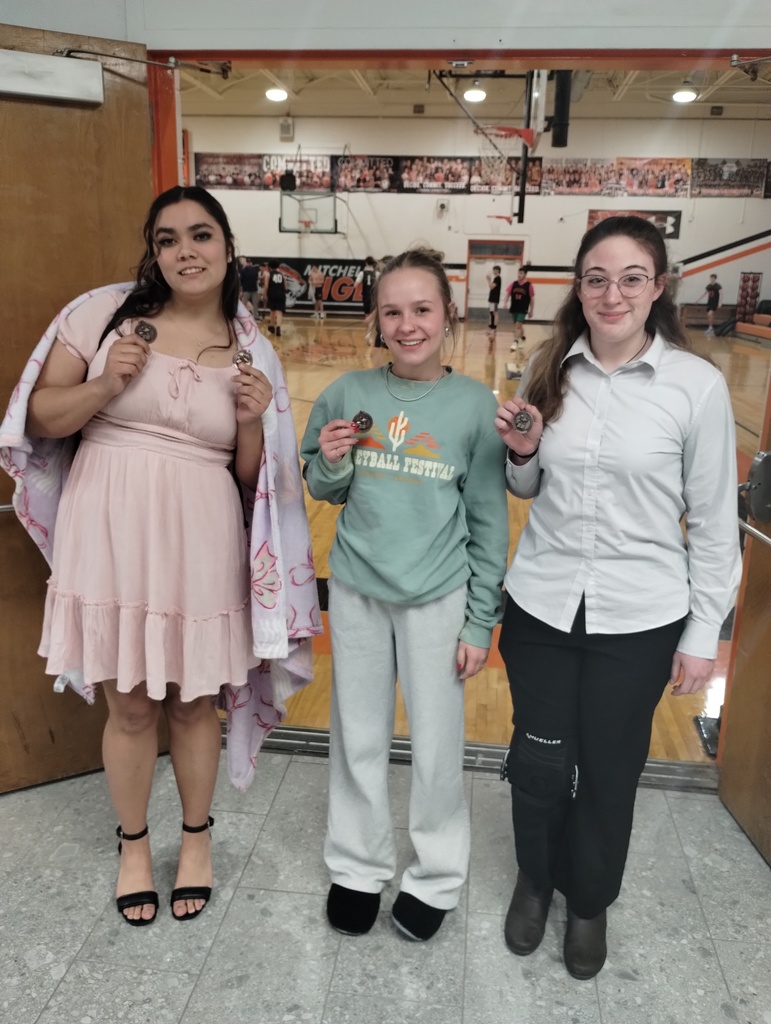 Three Students holding medals for speech meet