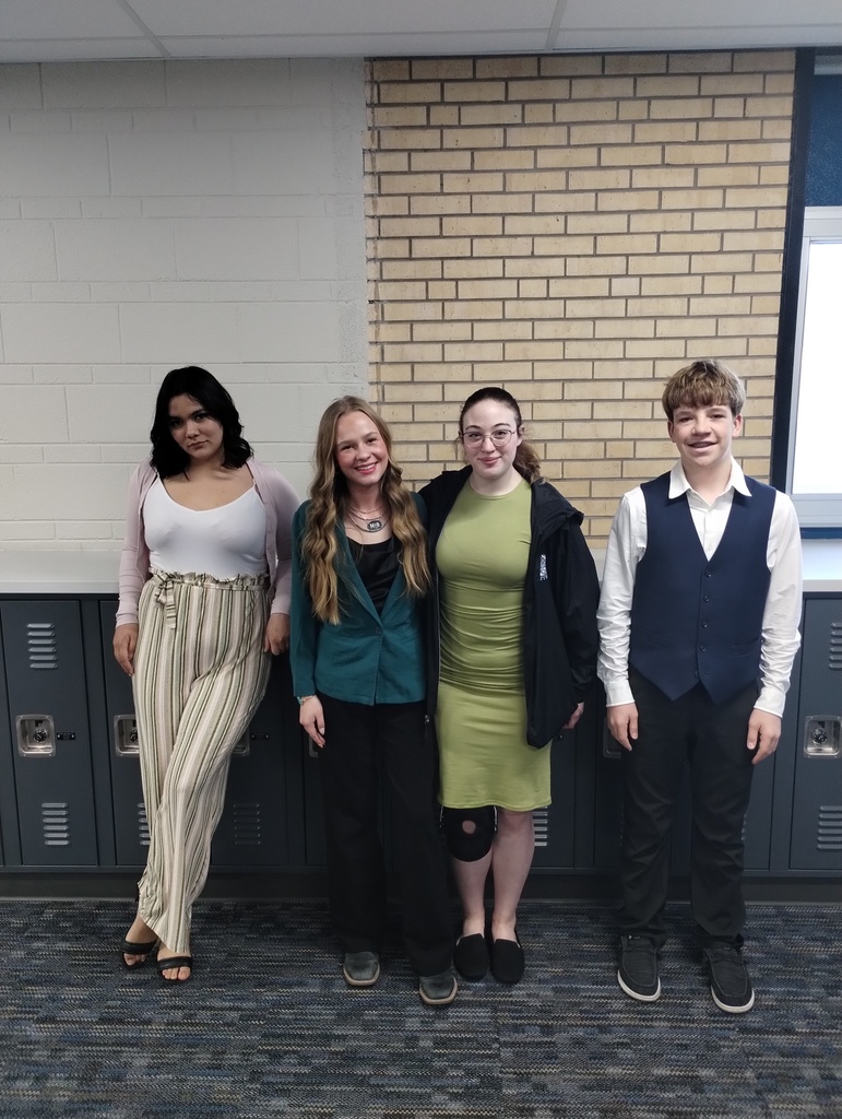 Four students who competed at a Speech Meet