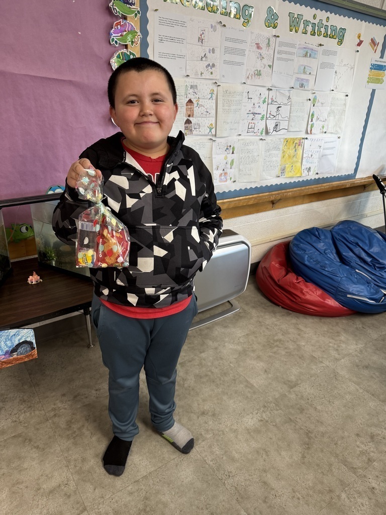 Student holding a prize for reading