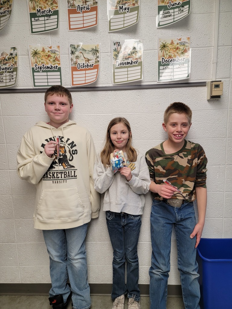 Student holding a prize for reading