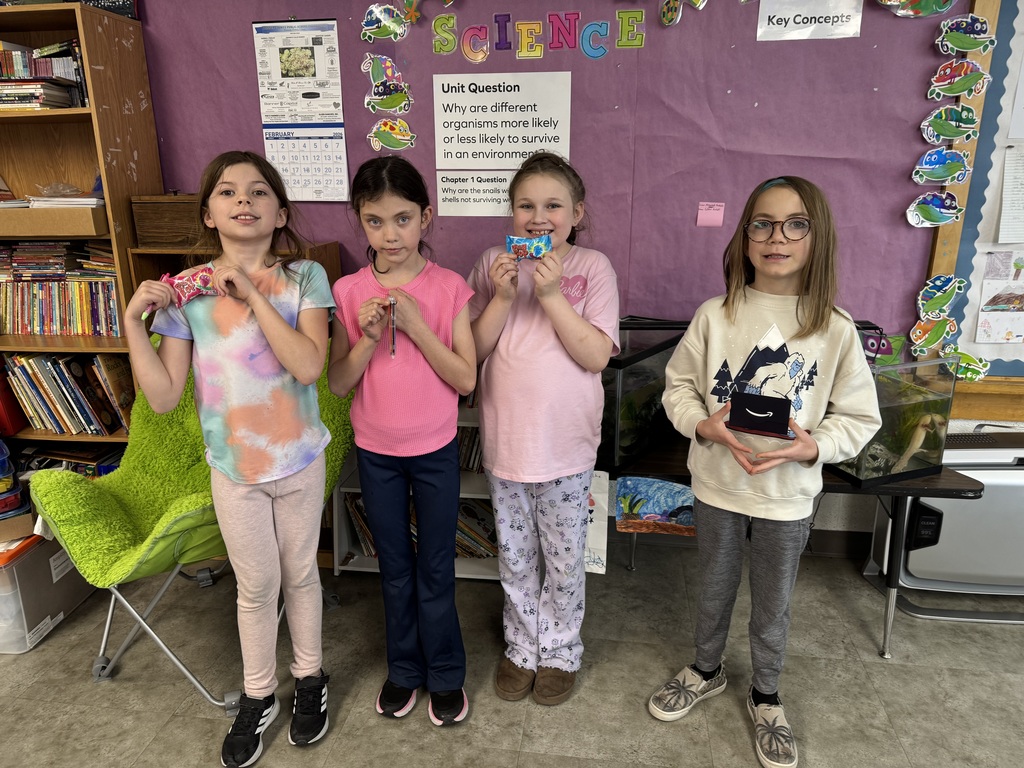 Student holding a prize for reading