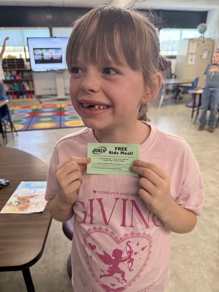 Student holding a prize for reading