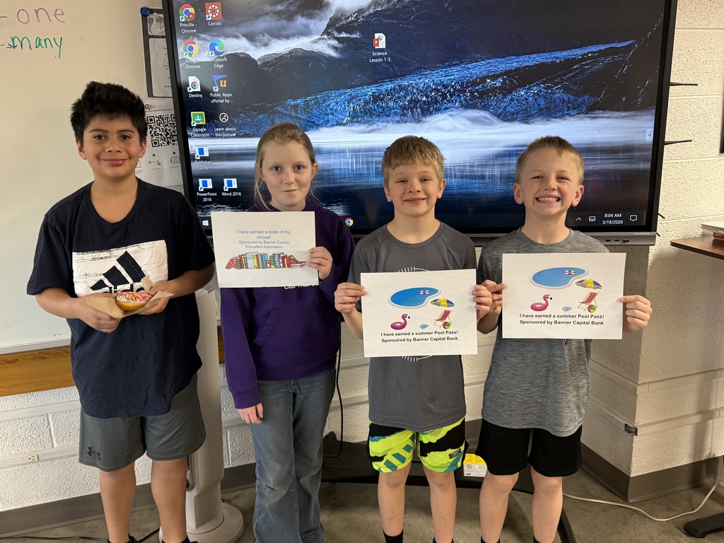 Student holding a prize for reading