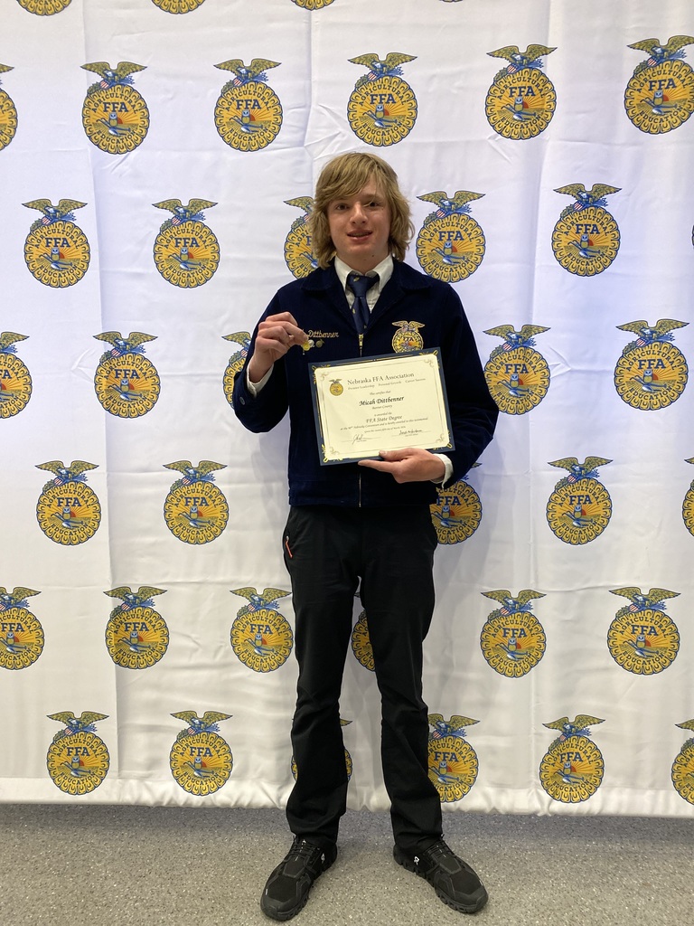 Student hold an award