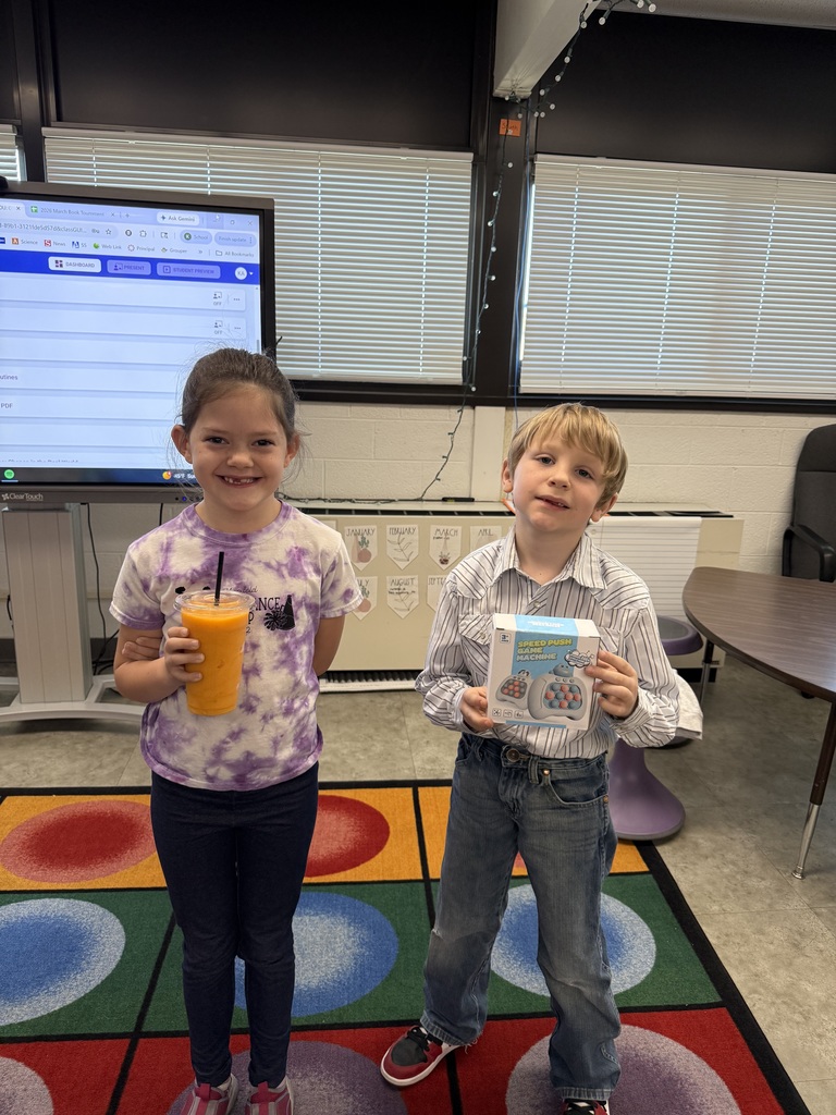Student holding a prize for reading