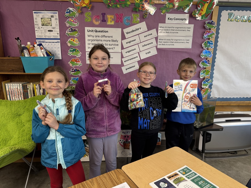 Student holding a prize for reading