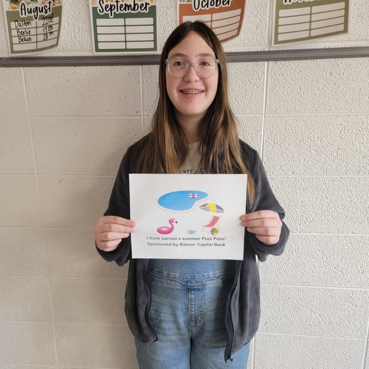 Student holding a prize for reading