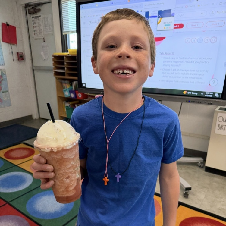 student holding a drink 