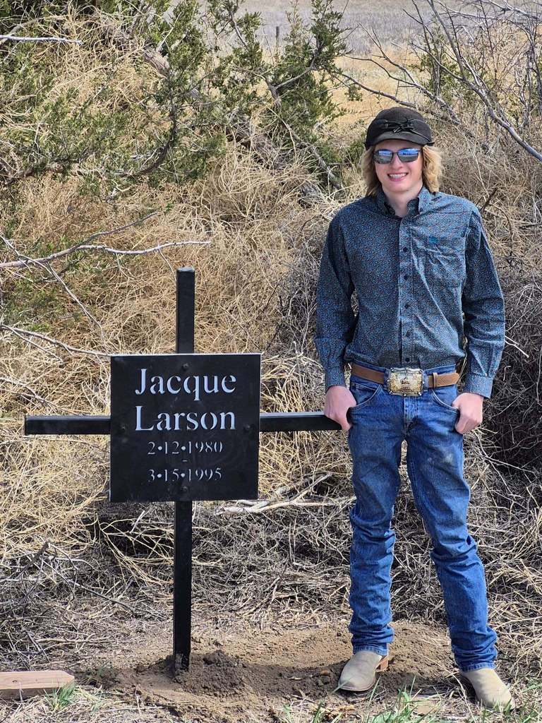 Student standing by a memorial 