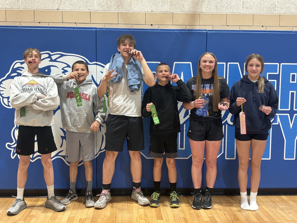 Student holding a prize for track