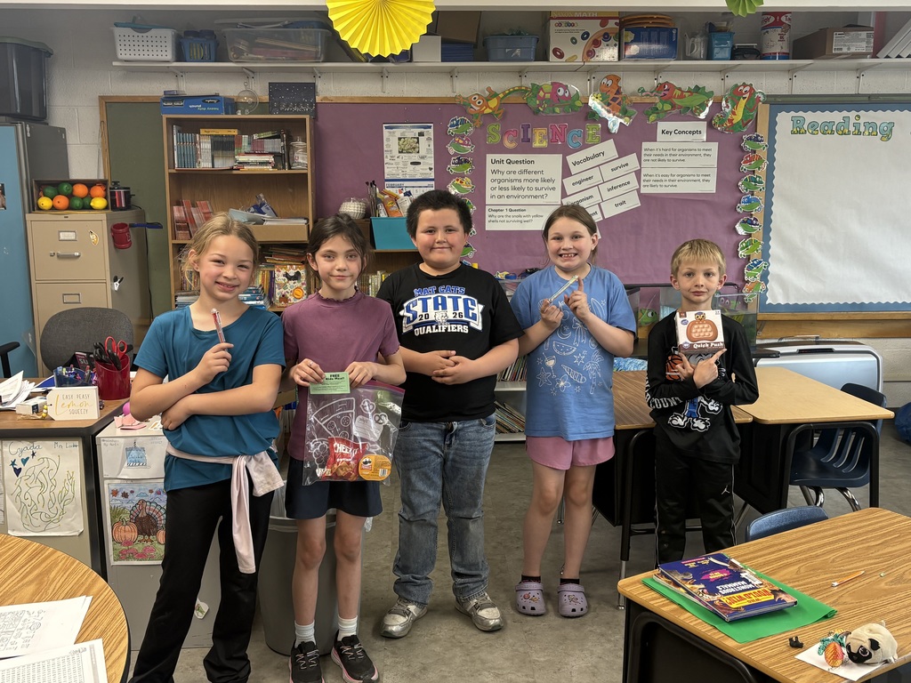 Student holding a prize for reading