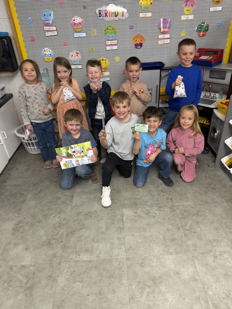 Student holding a prize for reading