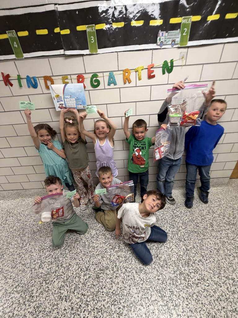 Student holding a prize for reading