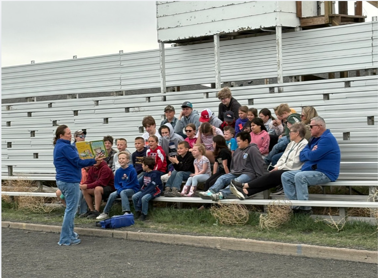 Group of students listening to a book