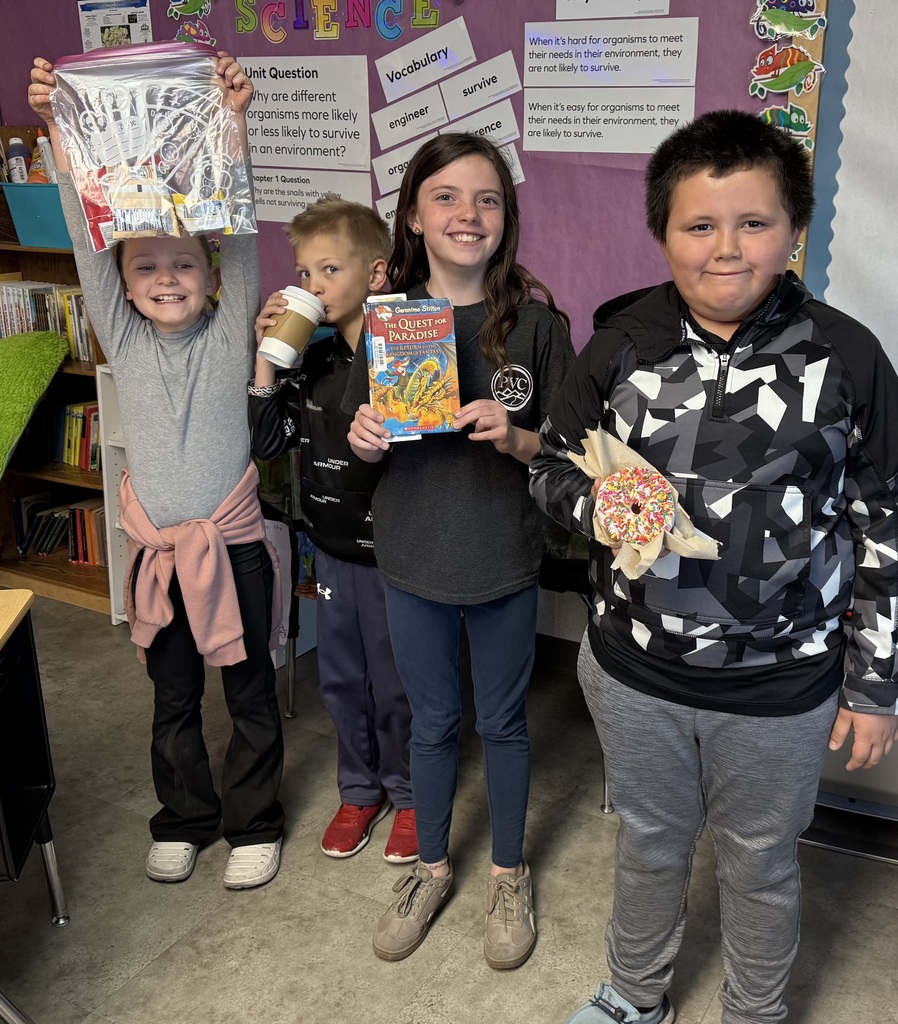 Student holding a prize for reading