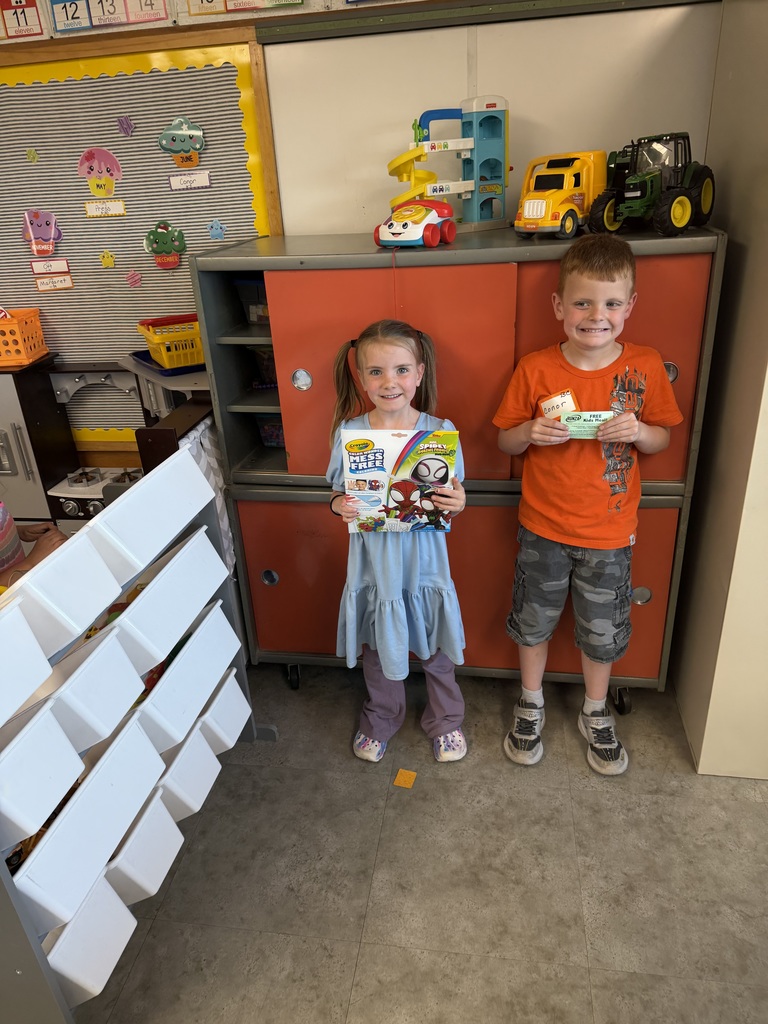 Student holding a prize for reading