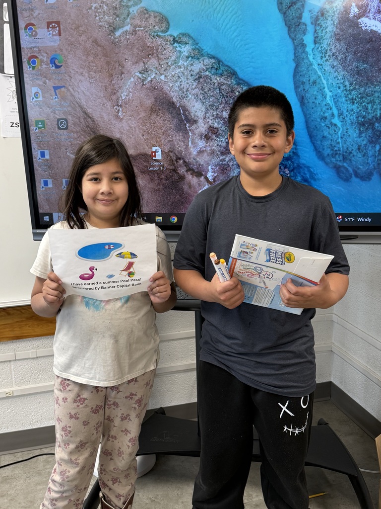 Student holding a prize for reading