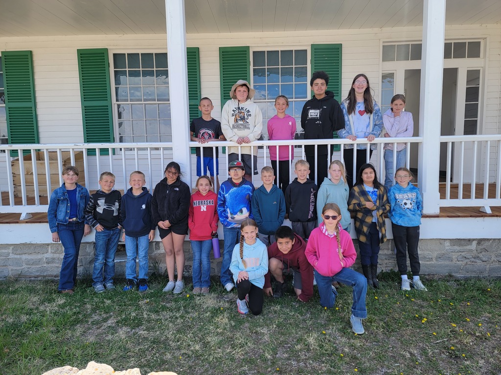 A series of photos showing Banner County students on a field trip to a historical museum or general store. Students are seen exploring vintage displays, looking at historical artifacts on wooden shelves, and gathered together in a rustic, wood-paneled building.