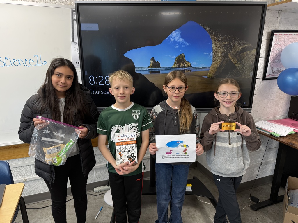 Student holding a prize for reading