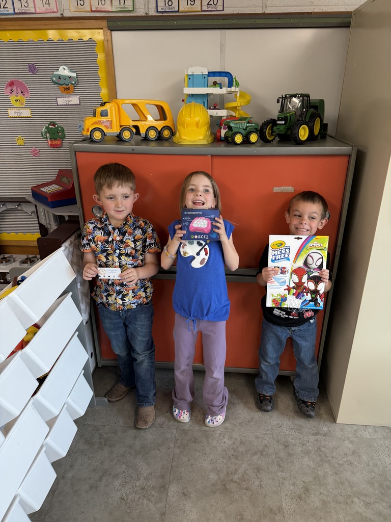 Student holding a prize for reading