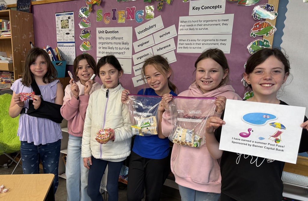 Student holding a prize for reading