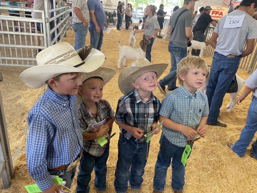 Group of boys standing with ribbons