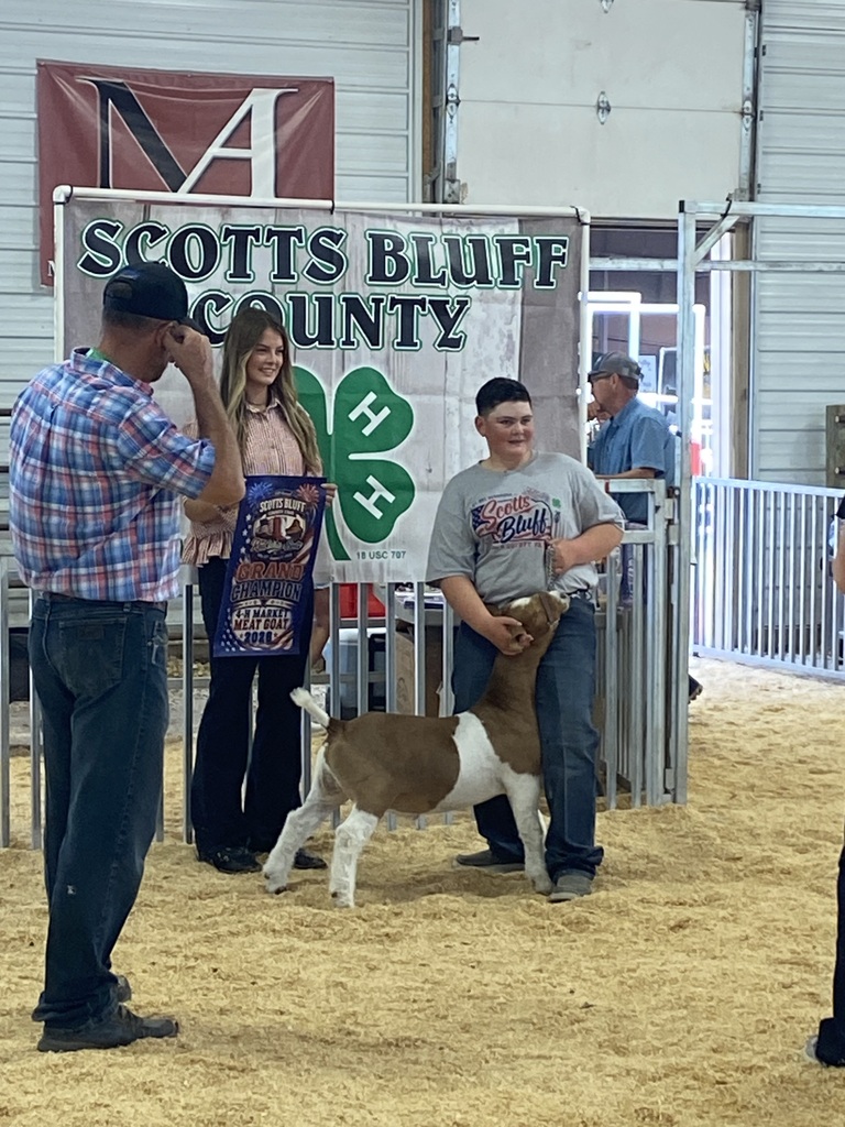 Boy showing his goat