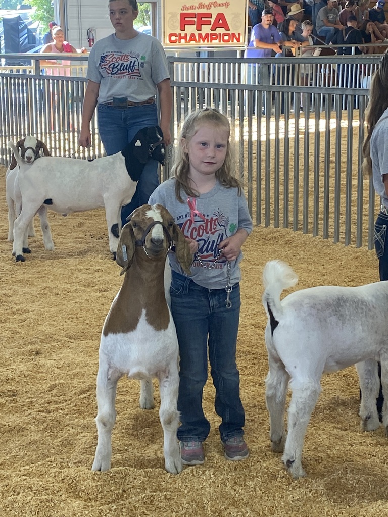 Girl showing her goat