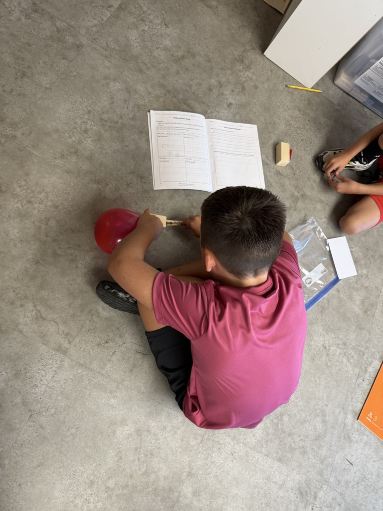 Students looking at blocks