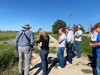 Students look at a gps