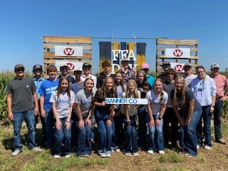 Students standing by an FFA sign