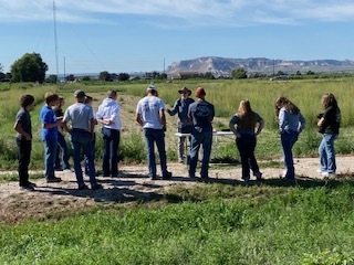 Students standing in a field