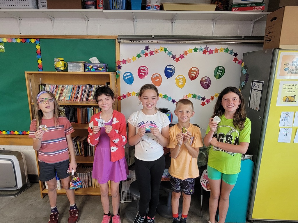 Group of students holding prizes for reading
