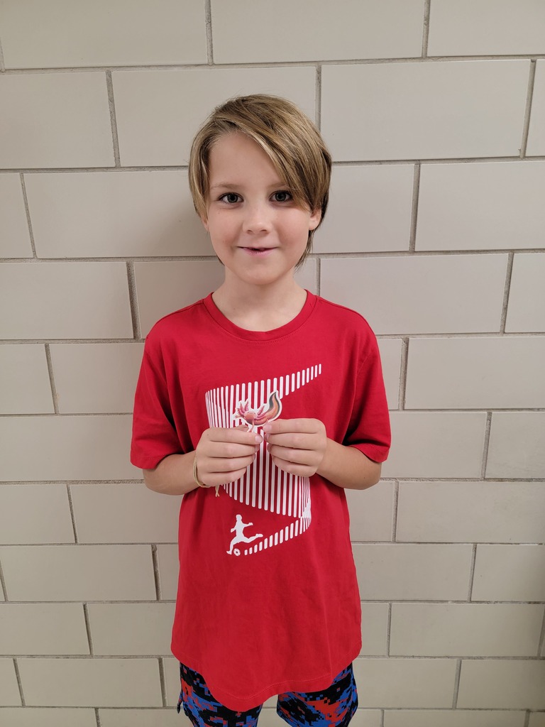 Student holding an AR prize