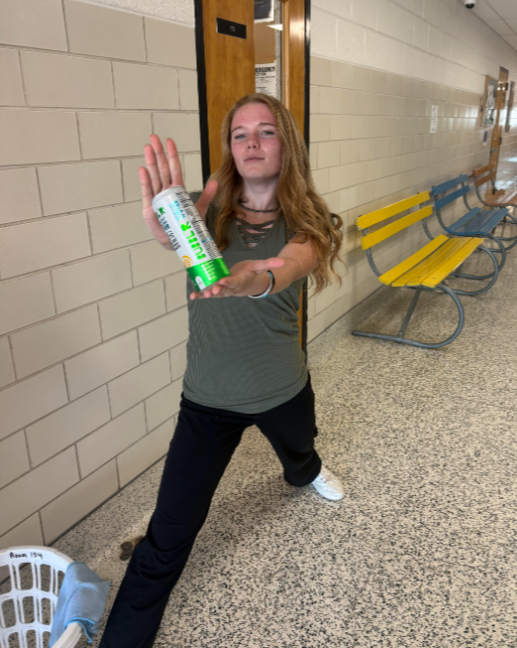 Student holding a drink