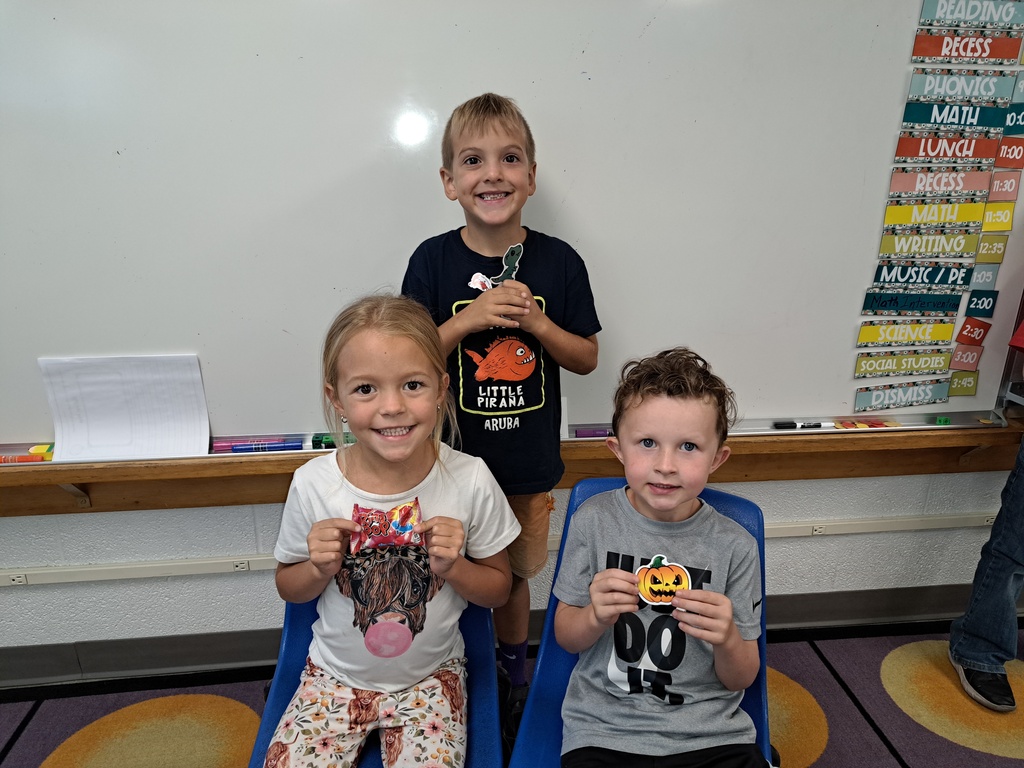 Students holding prizes for reading