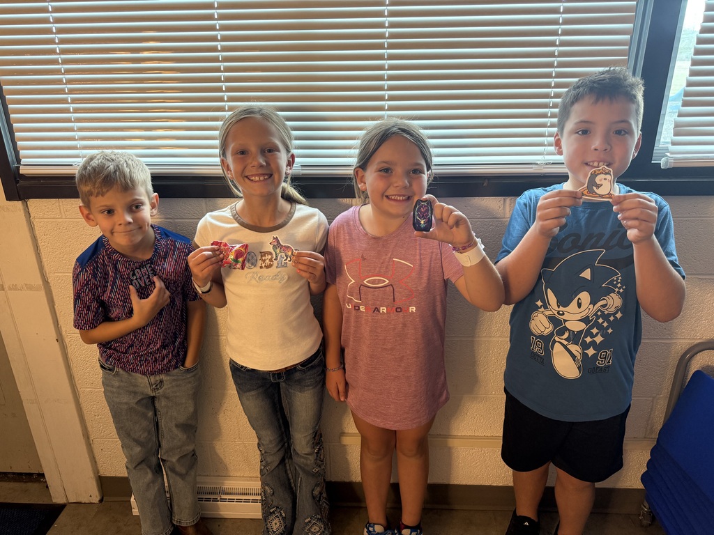 Students holding prizes for reading