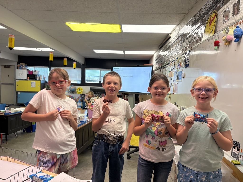 Students holding prizes for reading 