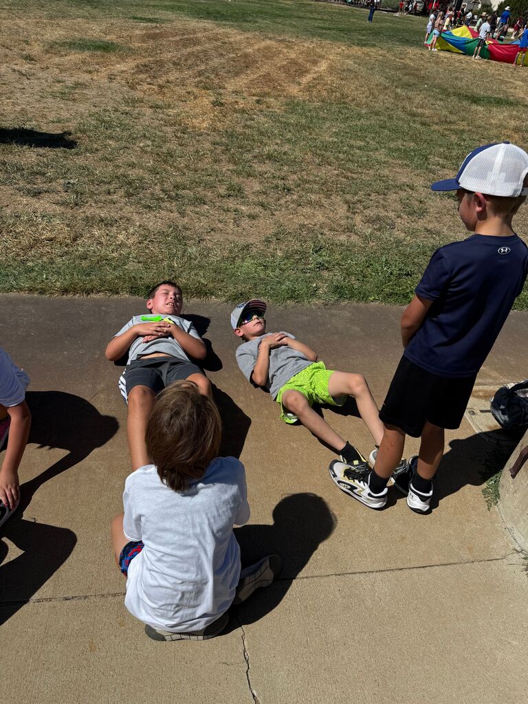 Students taking a break on the sidewalk