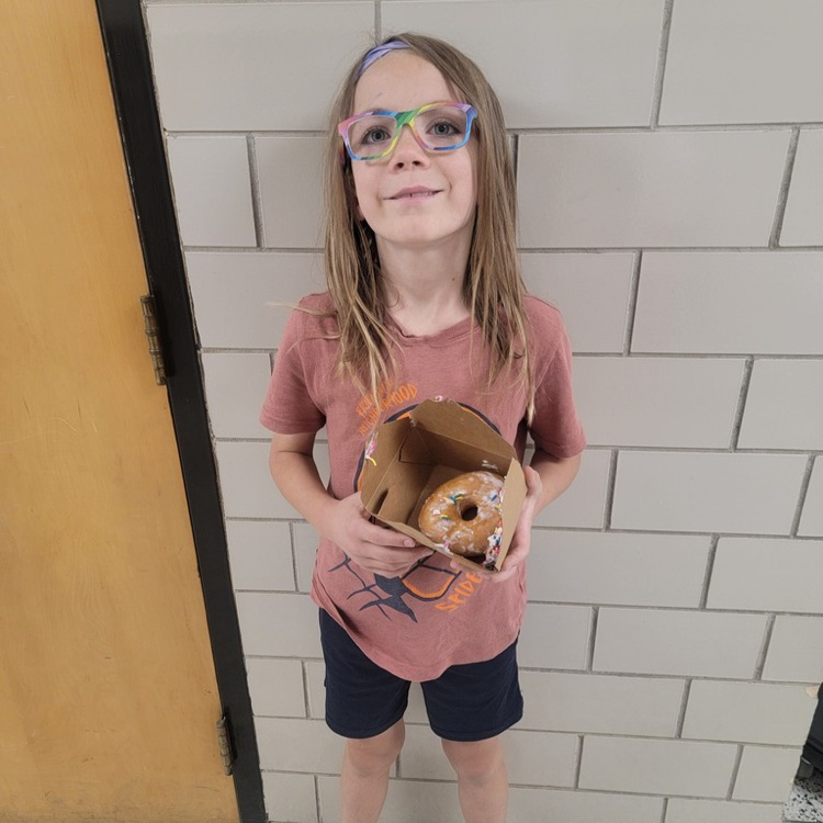Student holding a cookie